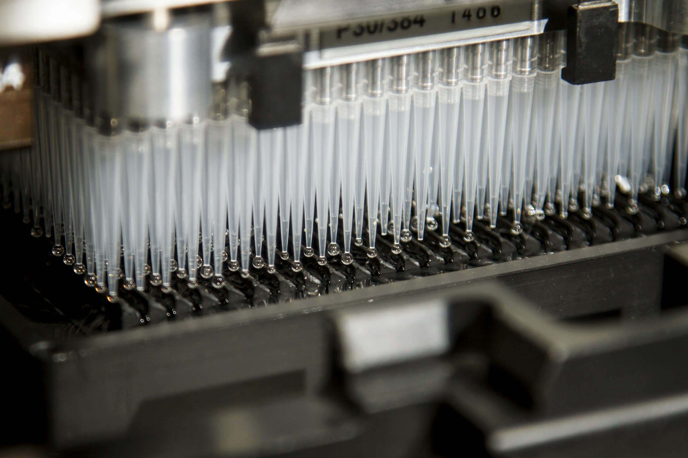 Automated laboratory pipettes processing samples in a diagnostic testing environment