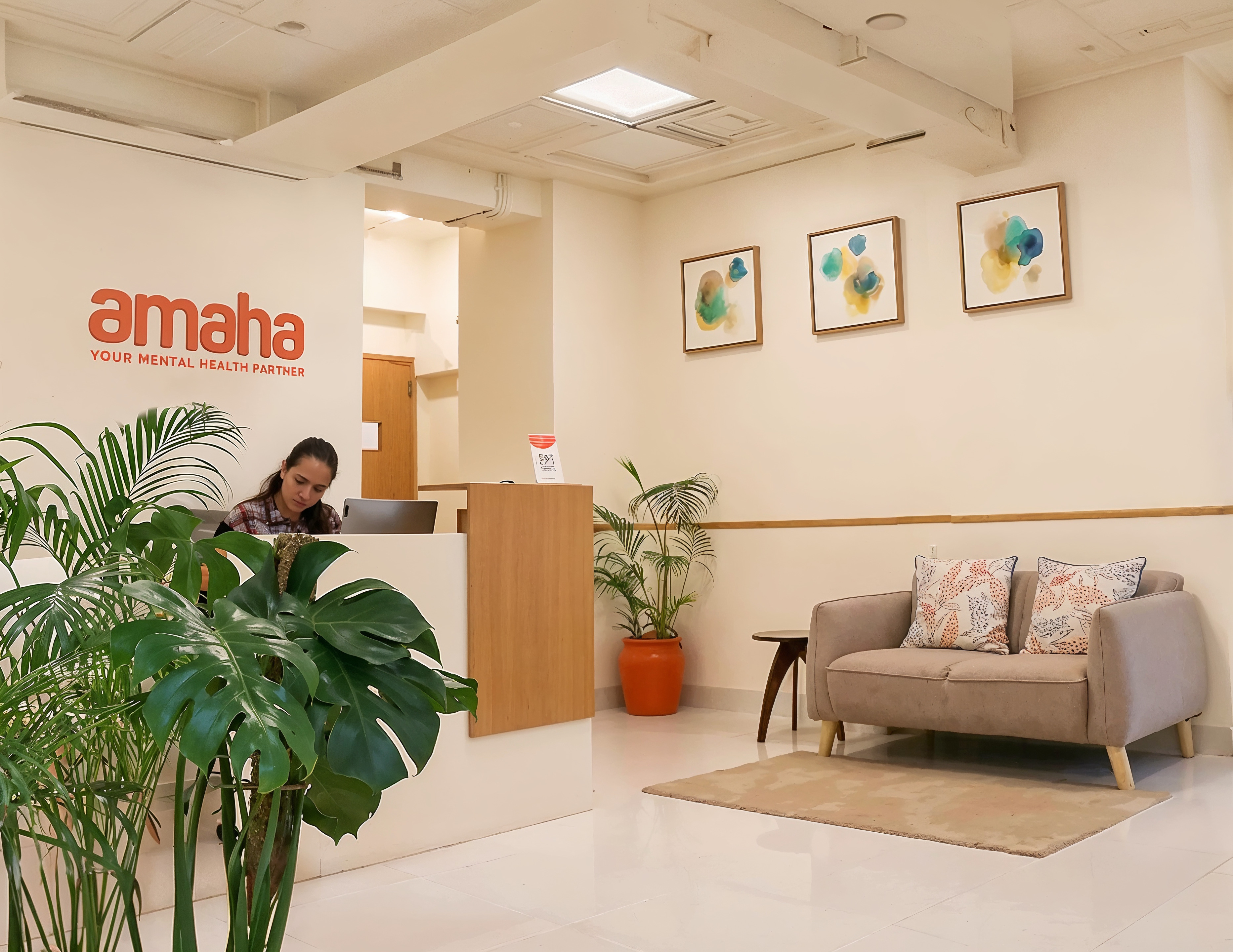 Amaha’s branded reception with a staff member at the desk