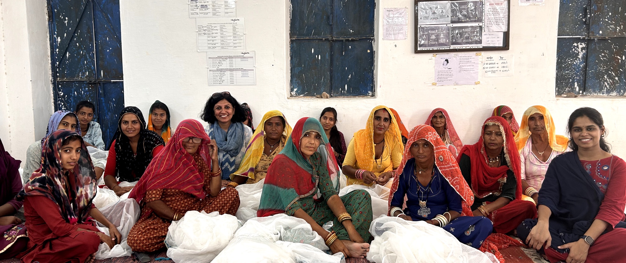 Rangsutra artisans gathered together at their centre with embroidery work